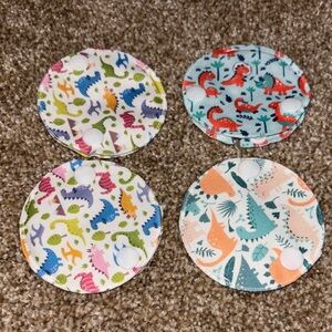 4 NWOT G Tube Dinosaur Print button covers. Helps with leaks, covers top button.